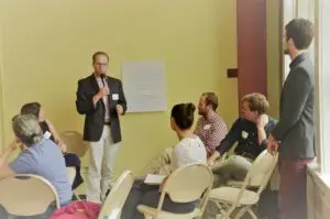 A group of people holds a discussion about transportation issues.