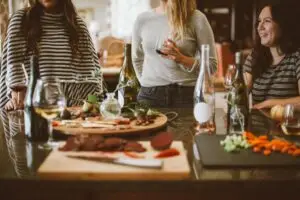 A group of friends enjoying food and drinks at Happy Hour. Photo credit: Kelsey Chance