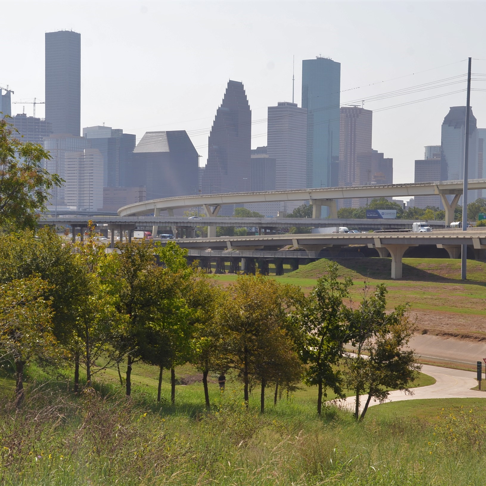 View of downtown Houston, I-45, and greenspace along White Oak Bayou