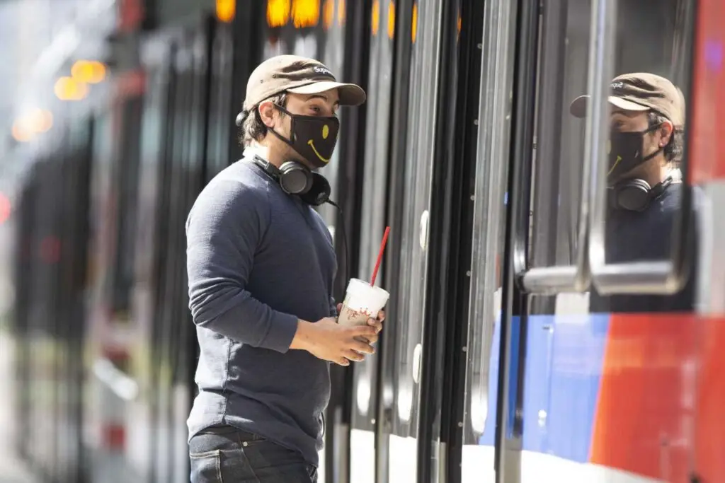 "A Metropolitan Transit Authority rail passenger boards a train at the Main Street Square station on Feb. 3, 2021, in downtown Houston. Since June when masks became required on transit, Metro has handed out 2 million masks. That's expected to continue as a federal requirement for mask use kicked in earlier this week. Yi-Chin Lee, Houston Chronicle / Staff photographer"