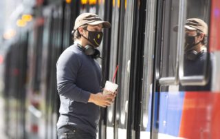 "A Metropolitan Transit Authority rail passenger boards a train at the Main Street Square station on Feb. 3, 2021, in downtown Houston. Since June when masks became required on transit, Metro has handed out 2 million masks. That's expected to continue as a federal requirement for mask use kicked in earlier this week. Yi-Chin Lee, Houston Chronicle / Staff photographer"