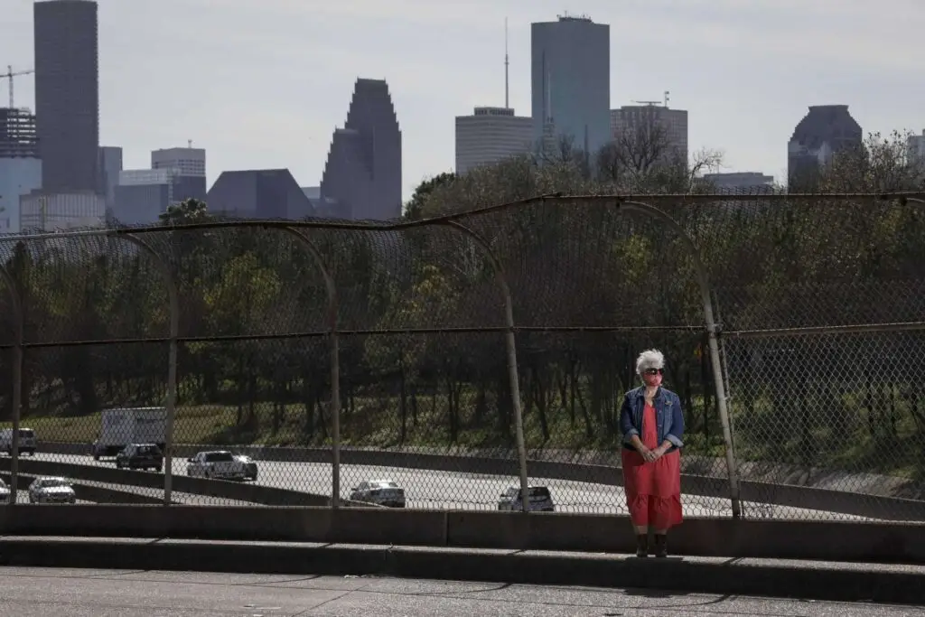 "Susan Graham, co-founder of Stop-TxDOT I-45, poses for a portrait Jan. 27, 2021, on the North Main Street bridge over Interstate 45 in Houston. Jon Shapley, Houston Chronicle / Staff photographer"