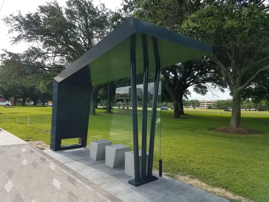 Photo by Gail Delaughter Houston Public Media. "Distinctive bus shelters in the Westchase District were designed to provide better lines of sight for enhanced safety."