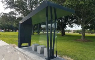 Photo by Gail Delaughter Houston Public Media. "Distinctive bus shelters in the Westchase District were designed to provide better lines of sight for enhanced safety."