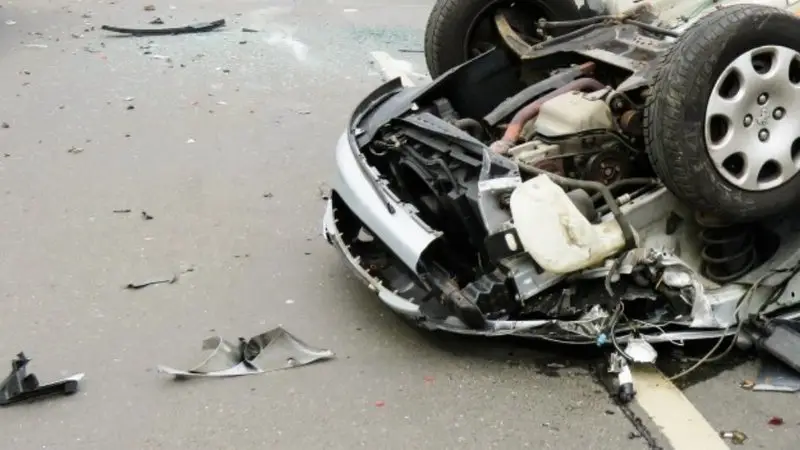 A car flipped upside down following a crash.