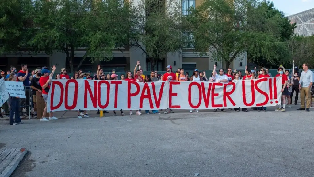 "Protestors on June 21, 2022, the day before demolition began on one building of The Lofts at Ballpark in Houston, TX. (Source: Stop TxDOT I-45.)"