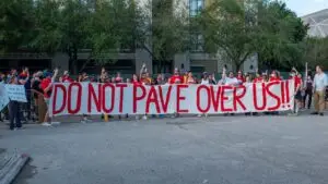 "Protestors on June 21, 2022, the day before demolition began on one building of The Lofts at Ballpark in Houston, TX. (Source: Stop TxDOT I-45.)"