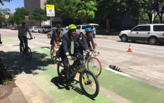 "Harris County Precinct 1 Commissioner Rodney Ellis bikes around the City Hall area in 2018, when he and Houston Mayor Sylvester Turner announced a new partnership between the city and Harris County to create more bike lanes."